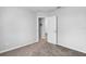 Small bedroom with carpet and an exterior door at 4364 Fox Glen Loop, Kissimmee, FL 34746