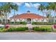 Community center with palm trees and landscaping at 4364 Fox Glen Loop, Kissimmee, FL 34746