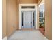 Light gray front door with sidelights at 4364 Fox Glen Loop, Kissimmee, FL 34746