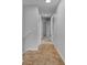 Upstairs hallway with carpeted floors and doors to bedrooms at 4364 Fox Glen Loop, Kissimmee, FL 34746