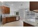 Kitchen boasts granite countertops and wood cabinets at 4364 Fox Glen Loop, Kissimmee, FL 34746