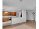 Modern kitchen with wood cabinets and stainless steel appliances at 4364 Fox Glen Loop, Kissimmee, FL 34746