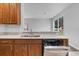 Kitchen features granite countertops and a double sink at 4364 Fox Glen Loop, Kissimmee, FL 34746