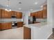 Open kitchen with island and stainless steel appliances at 4364 Fox Glen Loop, Kissimmee, FL 34746