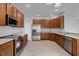 Spacious kitchen with stainless steel appliances and granite counters at 4364 Fox Glen Loop, Kissimmee, FL 34746