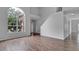 Bright living room with large window and stairs at 4364 Fox Glen Loop, Kissimmee, FL 34746
