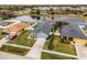 Aerial view of a house on a residential street near a lake at 540 E 19Th St, St Cloud, FL 34769