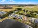 Aerial view of a house near farmland and a pond at 540 E 19Th St, St Cloud, FL 34769