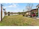 Large backyard with pond view and sitting area at 540 E 19Th St, St Cloud, FL 34769