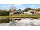 Backyard with deck and fenced-in area next to a pond at 540 E 19Th St, St Cloud, FL 34769