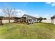 Large backyard with deck, pergola, and spacious lawn area at 540 E 19Th St, St Cloud, FL 34769