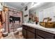 Bathroom with brick feature wall, dark vanity, and farmhouse decor at 540 E 19Th St, St Cloud, FL 34769