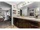 Bright bathroom features double sinks and a view into a bedroom at 540 E 19Th St, St Cloud, FL 34769