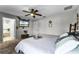 Main bedroom with king bed, en-suite bathroom access, and mounted TV at 540 E 19Th St, St Cloud, FL 34769