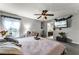 Main bedroom with king bed, en-suite bathroom view, and mounted TV at 540 E 19Th St, St Cloud, FL 34769