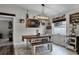 Farmhouse-style dining area with wooden table, bench seating, and charming decor at 540 E 19Th St, St Cloud, FL 34769