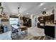 Eat-in kitchen with dark cabinetry, stainless steel appliances, and an island at 540 E 19Th St, St Cloud, FL 34769