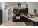 Modern kitchen with dark cabinets, stainless steel appliances, and a brick backsplash at 540 E 19Th St, St Cloud, FL 34769