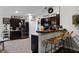 Kitchen with breakfast bar, dark cabinets, and stainless steel appliances at 540 E 19Th St, St Cloud, FL 34769