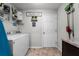 Convenient laundry room with washer, dryer, and storage shelves at 540 E 19Th St, St Cloud, FL 34769