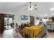 Open concept living area with L-shaped sofa, wood floors and access to patio at 540 E 19Th St, St Cloud, FL 34769