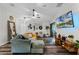 Living room with L-shaped couch, farmhouse decor, and wood floors at 540 E 19Th St, St Cloud, FL 34769