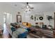 Spacious living room with L-shaped couch, farmhouse decor, and wood floors at 540 E 19Th St, St Cloud, FL 34769