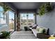 Relaxing sunroom with view, wicker furniture, and potted plants at 540 E 19Th St, St Cloud, FL 34769
