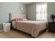 Simple bedroom with a tufted headboard, a soft comforter, bright natural light, and minimal decor at 570 Bristol Cir, Kissimmee, FL 34758