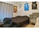 bedroom with sports-themed decor, a crib, and soft gray tones throughout at 570 Bristol Cir, Kissimmee, FL 34758