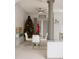 Bright dining room with a modern table set, stylish light fixture, column accent, and Christmas tree for the holidays at 570 Bristol Cir, Kissimmee, FL 34758
