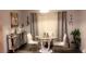 Elegant dining area with a glass-top table, stylish chairs, and a mirrored sideboard at 570 Bristol Cir, Kissimmee, FL 34758