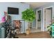 Exercise room with a stationary bike, TV, and a glimpse into an adjacent bathroom at 570 Bristol Cir, Kissimmee, FL 34758