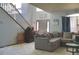 Living area with staircase and sectional sofa at 570 Bristol Cir, Kissimmee, FL 34758