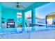 Covered outdoor kitchen with granite countertops and Blackstone griddle at 570 Bristol Cir, Kissimmee, FL 34758