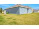 Expansive backyard with lush green grass, privacy fence and neutral exterior paint at 6144 Forest Ridge Way, Winter Haven, FL 33881
