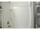 Bright, tiled shower and tub combination with sleek fixtures and a modern shower curtain for a clean, updated look at 6144 Forest Ridge Way, Winter Haven, FL 33881
