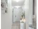 Bright entryway featuring tile flooring, white walls and decorative console table at 6144 Forest Ridge Way, Winter Haven, FL 33881