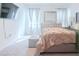 Bedroom with a tufted headboard bed and silver furniture set at 6144 Forest Ridge Way, Winter Haven, FL 33881