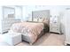 Bedroom with a tufted headboard bed and silver furniture set at 6144 Forest Ridge Way, Winter Haven, FL 33881