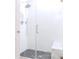 Shower featuring glass doors, tiled walls, shower bench and rain style shower head at 6144 Forest Ridge Way, Winter Haven, FL 33881