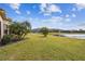 Landscaped backyard with lake view and lush green grass at 644 San Raphael St, Kissimmee, FL 34759