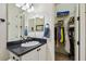 Bathroom with shower, toilet, vanity, and walk-in closet at 644 San Raphael St, Kissimmee, FL 34759