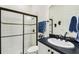 Bathroom with walk-in shower, vanity, and toilet at 644 San Raphael St, Kissimmee, FL 34759