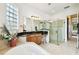 Elegant bathroom featuring a soaking tub, walk-in shower, and dual sinks at 644 San Raphael St, Kissimmee, FL 34759