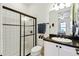 Bathroom with shower, toilet, and vanity with dark countertop at 644 San Raphael St, Kissimmee, FL 34759