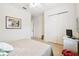 Spacious bedroom with a queen-size bed, large closet, and window at 644 San Raphael St, Kissimmee, FL 34759