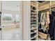 Well-organized closet with shoe shelves and hanging rods at 644 San Raphael St, Kissimmee, FL 34759