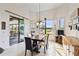 Bright dining room with large window overlooking tranquil water view at 644 San Raphael St, Kissimmee, FL 34759