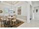 Formal dining room with a round table, chandelier, and access to other rooms at 644 San Raphael St, Kissimmee, FL 34759